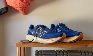 The New Balance Fresh Foam X 1080 v14 Women's Running Shoes displayed on top of a shoe rack