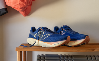 The New Balance Fresh Foam X 1080 v14 Women's Running Shoes displayed on top of a shoe rack